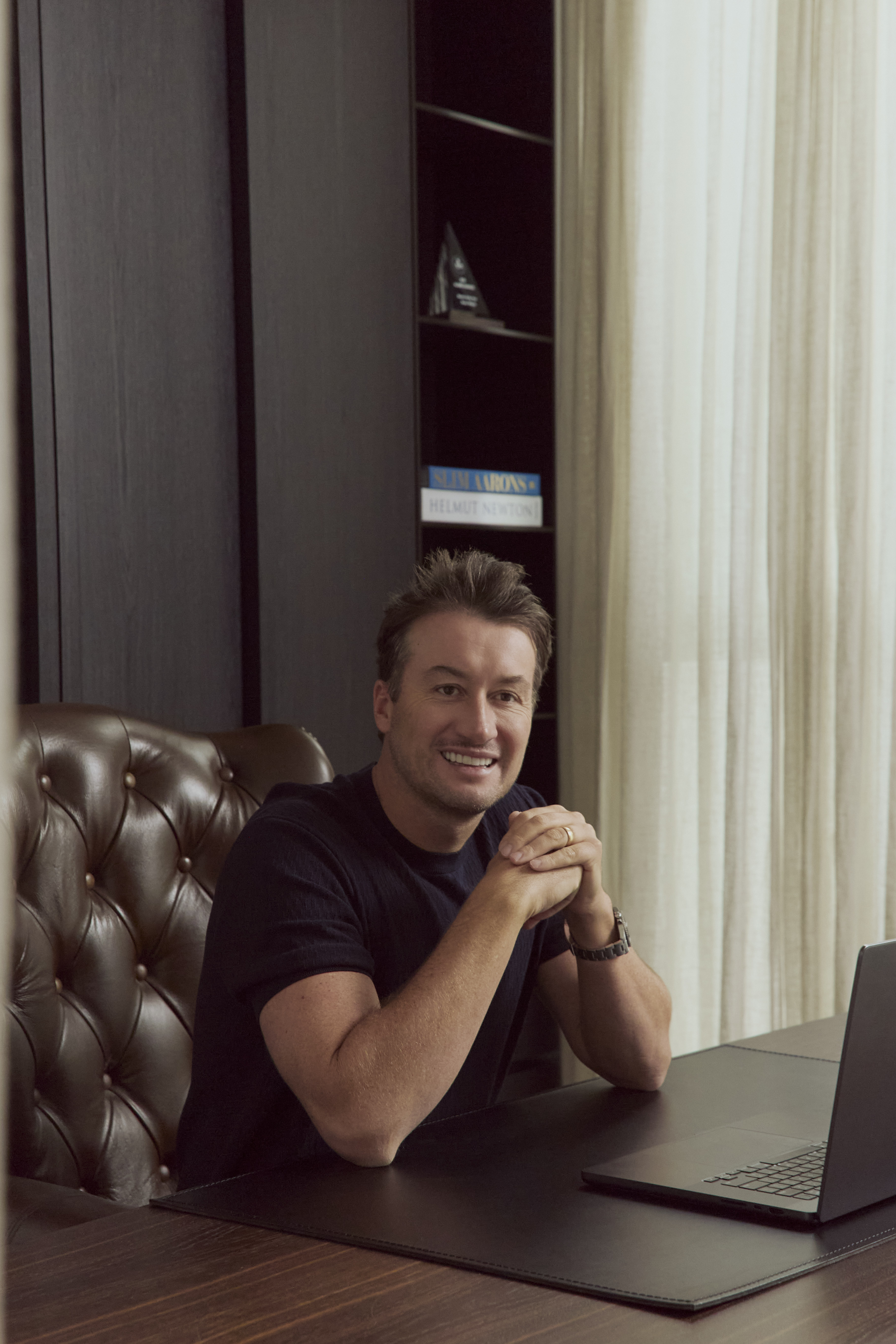 Shaun Wilson, Founder of Sol Rise Partners, seated at his desk